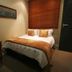1109 The Decks at 67 Long Street in Cape Town guest room with double bed, bedside table and window blinds