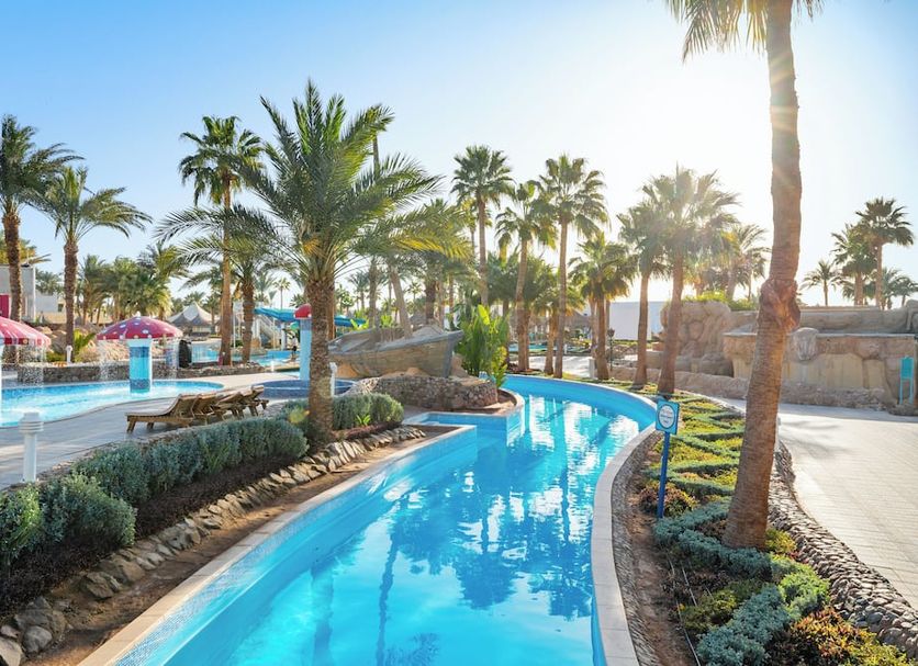 Palm-lined pool at Pickalbatros Golf Luxury Suites - All Inclusive in Sharm el-Sheikh