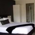 Abode On Courtenay Motor Inn in New Plymouth: guest room with king bed, desk, and ensuite bathroom