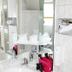 eXo Hotel Franka Bamberg bathroom sink with mirror, toiletries and wall-mounted hair dryer in Hallstadt