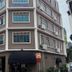 The Quay Hotel Bugis in Singapore, exterior corner view of the hotel building with awnings