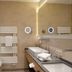 Familienparadies Sporthotel Achensee bathroom with bathtub, shower, double sinks and heated towel racks in Achenkirch