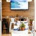 Yam Hotel - an Atlas Boutique Hotel in Tel Aviv breakfast area with tables and wall-mounted TV