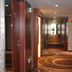 Yiwu Mango Hotel in Jinhua hallway with patterned carpet and recessed ceiling lights