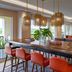 Fort Lauderdale Marriott Coral Springs Hotel & Convention Center lounge with long table, bar seating and greenery