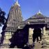Hotel Pooja International in Nashik, stone temple-style exterior with carved tower and entrance