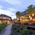 Seerose Resort & Spa in Meisterschwanden with lakeside terrace and illuminated outdoor dining area