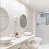 Le Cameleon Boutique Hotel bathroom in Puerto Viejo de Talamanca with double vessel sinks and walk-in shower