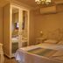 Panamare Apart Hotel Akyaka bedroom with double bed, mirrored wardrobe and air conditioner in Akyaka