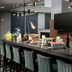 Breakfast bar at Residence Inn by Marriott New Orleans Elmwood with seating, beverages, and food display