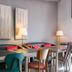 Hôtel Edmond Rostand in Marseille lounge seating area with tables, sofas, and floor lamps