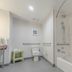 Hampton Inn Santa Clarita-Valencia bathroom with toilet, tub-shower, and accessibility grab bars