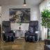 Foz Central Budget Hotel lobby with two massage chairs and a waterfall wall photo in Foz do Iguaçu