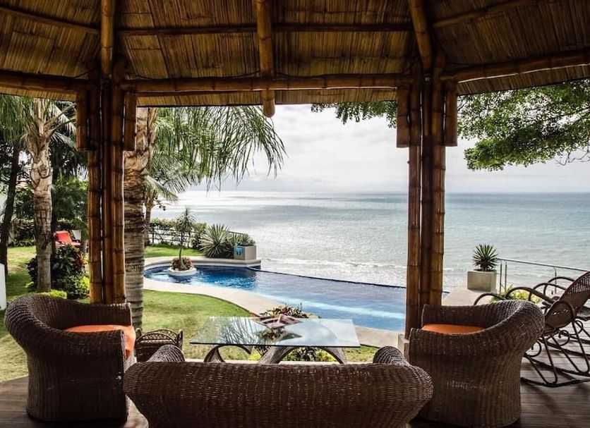 Hotel Vistalmar in Manta with oceanfront pool, lounge seating, and sea view