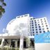 Mantra Melbourne Airport exterior with white facade and blue sign in Melbourne