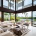 Rosewood Mayakoba in Playa del Carmen with open lounge, floor-to-ceiling windows, and lagoon views