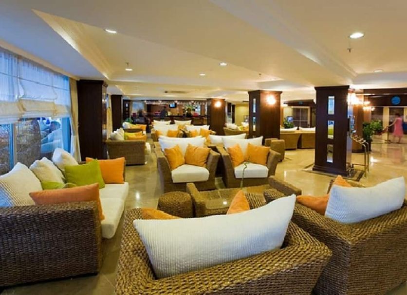 Latanya Park Resort in Bodrum lounge with wicker seating and bright cushions in a spacious lobby