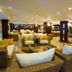 Latanya Park Resort in Bodrum lounge with wicker seating and bright cushions in a spacious lobby
