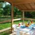 Lagrange Vacances Les Ségalières in Gramat, outdoor covered patio with table and chairs