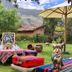 Hotel La Casona De Yucay Valle Sagrado in Yucay, outdoor garden seating with colorful pillows and mountain views