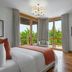 Parklane, a Luxury Collection Resort & Spa, Limassol room with balcony doors, garden view, and sitting area in Pyrgos