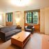 Colosseum Inn Tateshina guest room with sofa, armchair, coffee table and twin beds