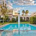 Doña Urraca Hotel & Spa in Santiago de Querétaro with courtyard pool, arches and palm trees