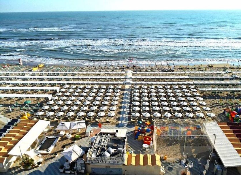 Hotel Daniel's Fronte Mare in Riccione with beach umbrellas and loungers facing the sea