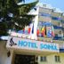 Hotel Rina Vista in Braşov exterior with balconies, flags, and hotel entrance sign
