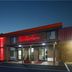 Red Roof Inn Hillsville exterior at night with red-lit facade and entrance