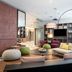 Citadines Arnulfpark Munich lobby lounge in Munich with seating, shelves, TV and a potted plant