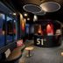Therme 51, Leukerbad: modern hotel lobby with curved reception desk and lounge seating