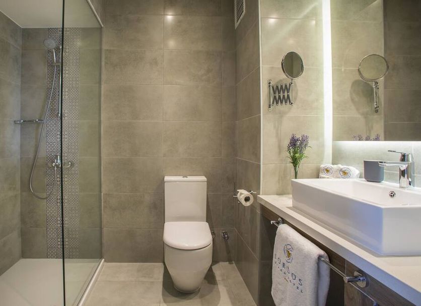 Lordos Beach Hotel & Spa Larnaca bathroom with walk-in shower, toilet and vessel sink