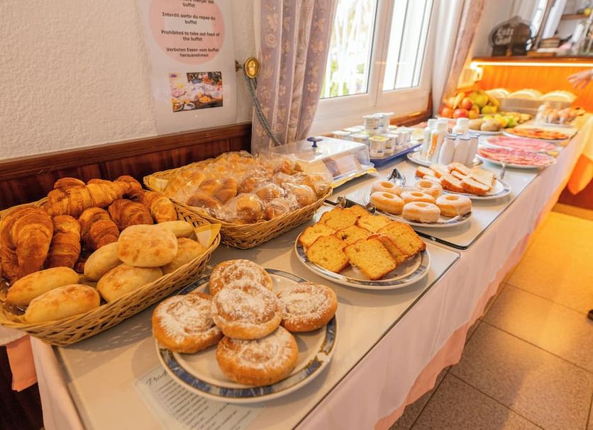 Hotel Montana by Bossh! Hotels in Roses breakfast buffet with pastries, bread, fruit and juice
