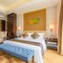 Pearl River Garden Hotel Changsha guest room with king bed, chaise lounge, and upholstered bench