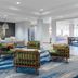 Fairfield Inn & Suites by Marriott Rapid City lobby seating area with blue wave-pattern carpet