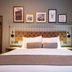 The Hawes Inn by Innkeeper's Collection in South Queensferry bedroom with tufted headboard and framed wall art