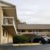 Rodeway Inn Jonesboro - Atlanta South exterior with parked cars and two-story motel building
