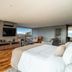 Chris Park Hotel in Campos do Jordão guest room with floor-to-ceiling windows, balcony, and mountain view