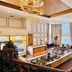 Ramada Plaza by Wyndham Garden Grove/Anaheim South lobby with chandelier, seating area and tall windows