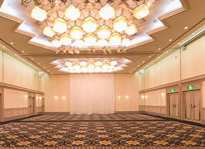 Tokushima Washington Hotel Plaza in Tokushima ballroom with ornate ceiling lights and patterned carpet