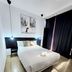 AYZ Javier Cabrini in Madrid: simple guest room with double bed, wall art, hanging lights, and dark curtains