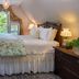 1899 Wright Inn & Carriage House in Asheville guest room with bed, floral throw, and window seat
