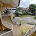 Sunny Point Hotel in Davao City courtyard view from staircase with garden and paved driveway