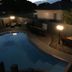 Raceway Motel Whanganui pool courtyard at dusk with outdoor seating and lit lamps