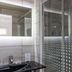 Hotel A.S. Sao Joao da Madeira bathroom with sink and glass shower in São João da Madeira