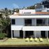 Vivenda Belo Horizonte in Caniço, white villa with balcony, sun loungers and outdoor pool