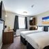 Canterbury Bell, Margate by Marston's Inns room with two twin beds and wall-mounted TV in Broadstairs