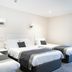 The Appleby Inn Hotel in Swadlincote: triple guest room with three single beds and wall lights