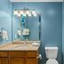 WorldMark Lake of the Ozarks bathroom in Osage Beach with vanity, toilet, and shower tub